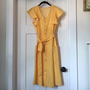 Yellow summer dress with white polka dots